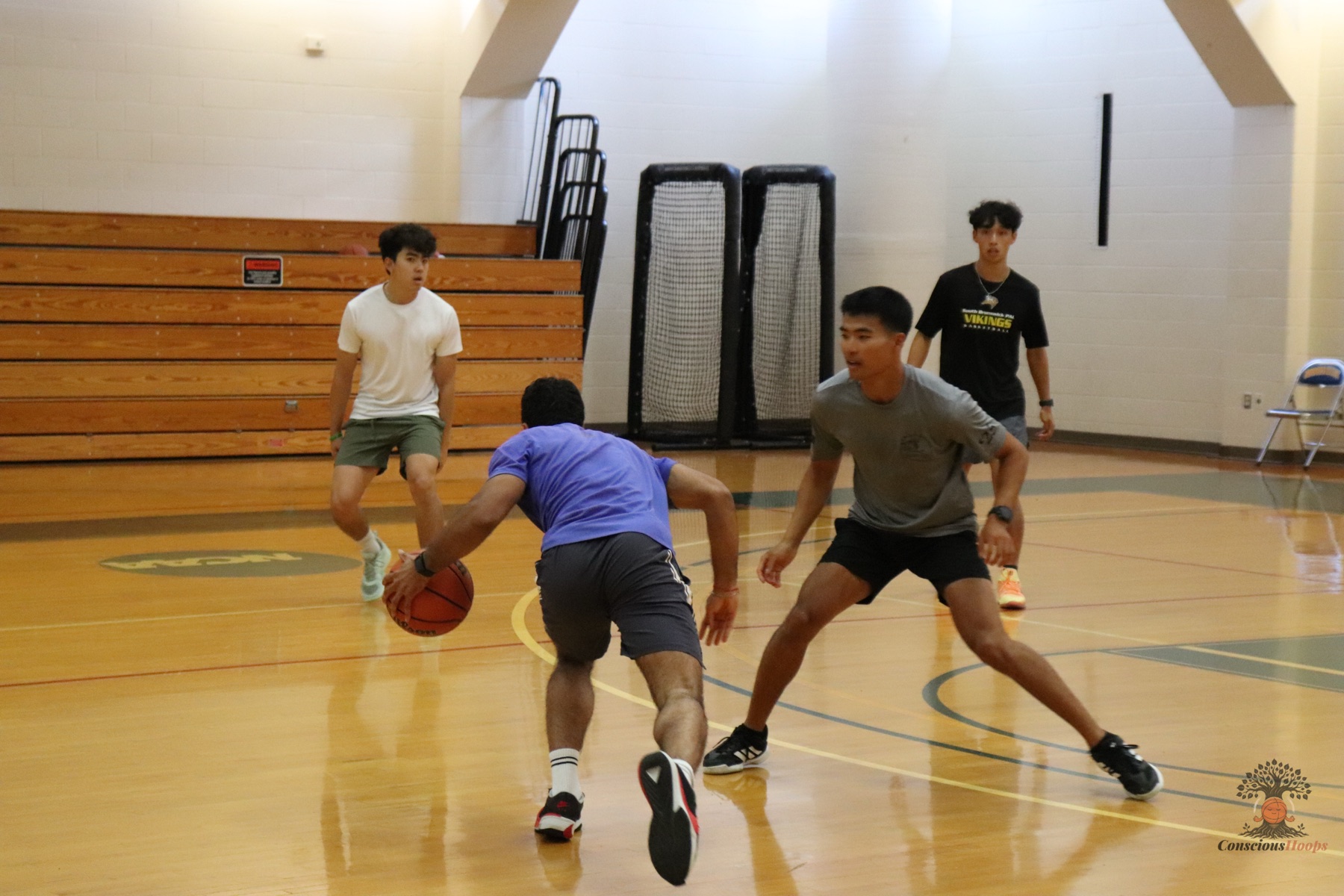 A ball handler drives past a defender during pick-up play