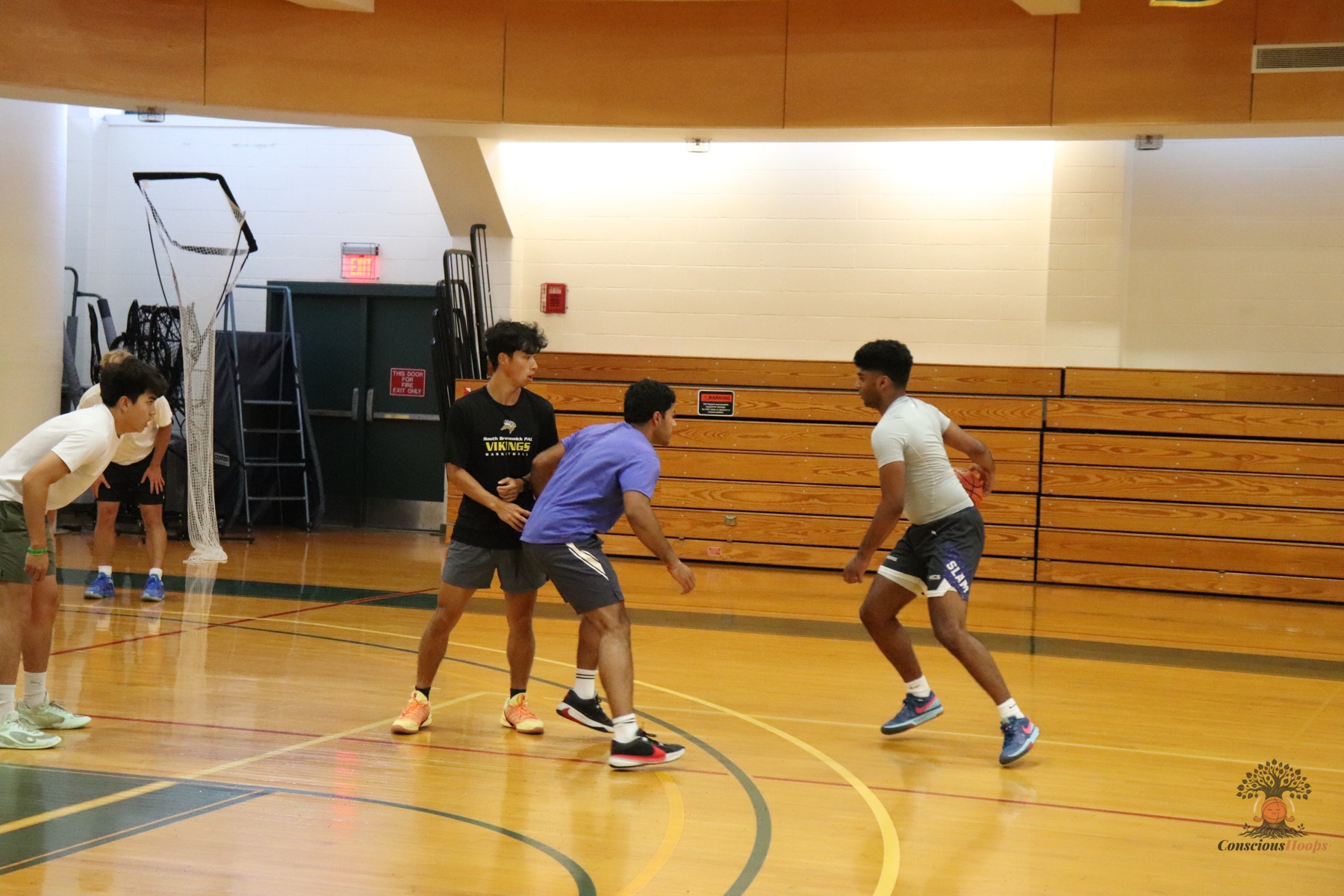 Players setting up a possession on the wing